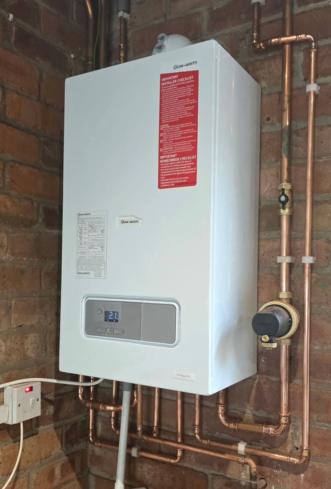 Newly installed Glow-worm combi boiler ready for commissioning and Benchmark sign-off