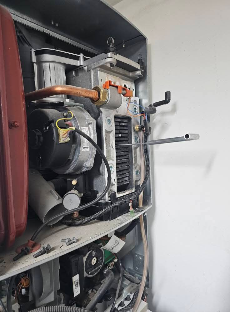 Boiler internals exposed for a diverter valve replacement during a same-day repair