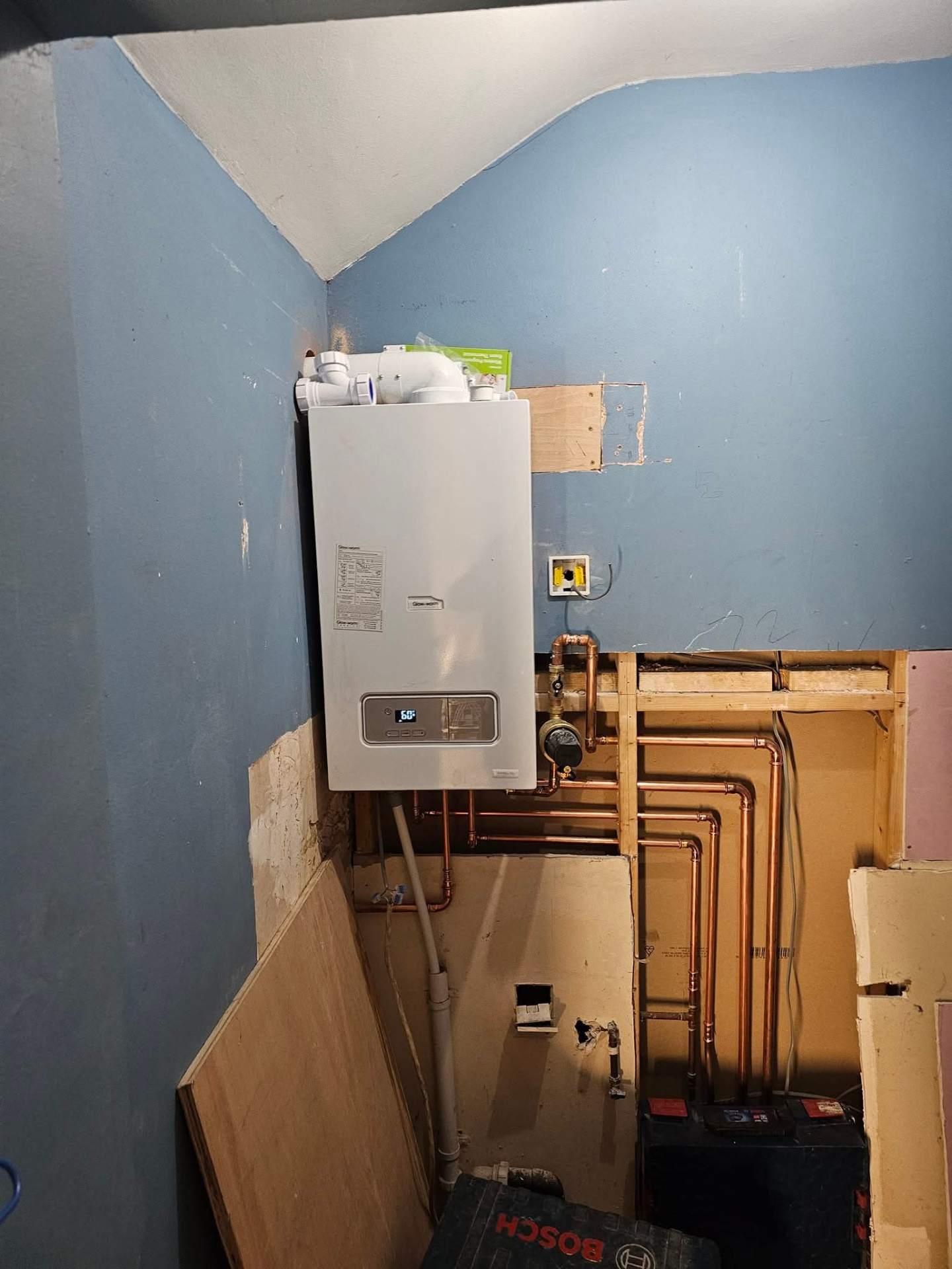 Boiler installed inside a cupboard with concealed flue and condensate run