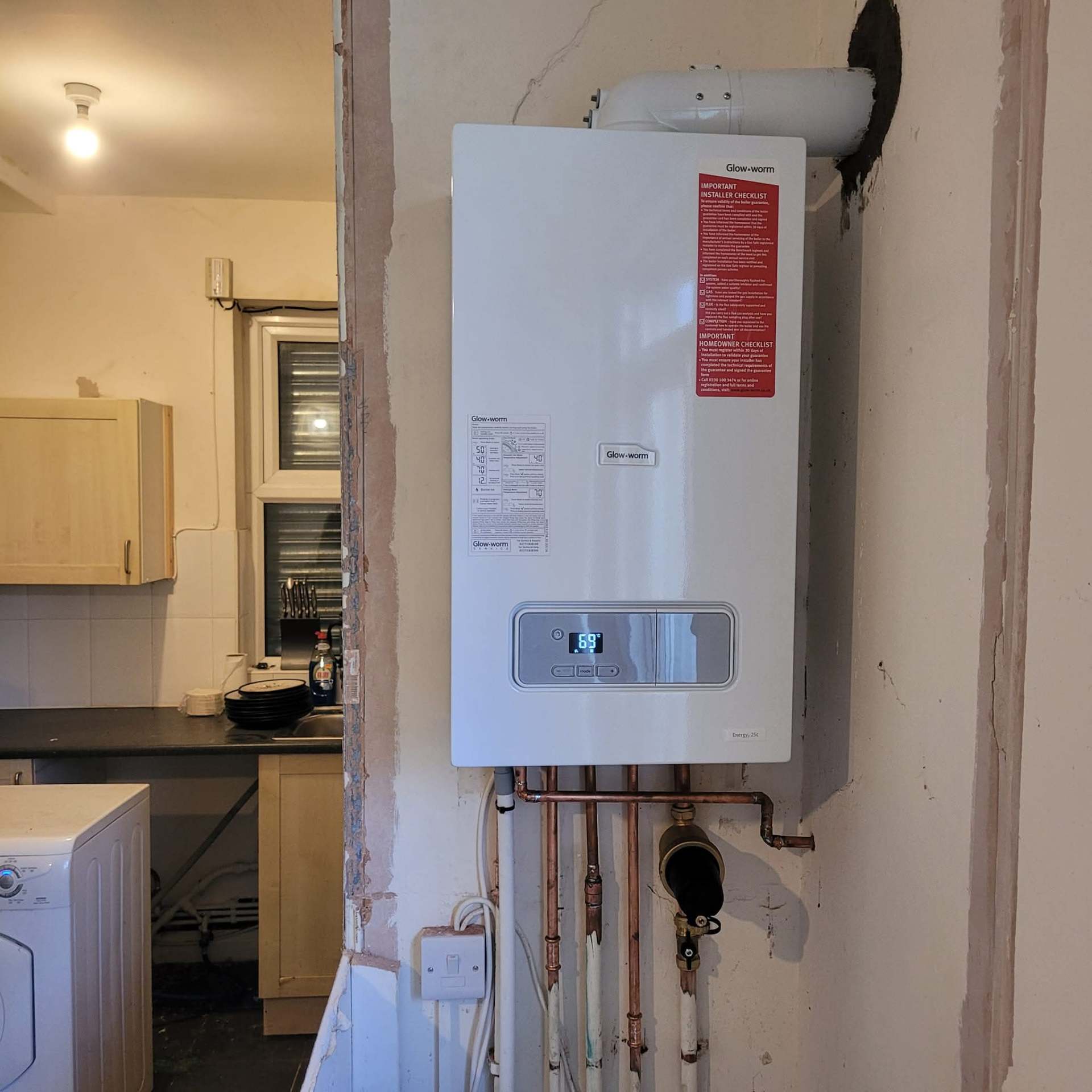 New Glow-worm gas combi boiler installation in a Greater Manchester kitchen by C Nixon Plumbing & Heating